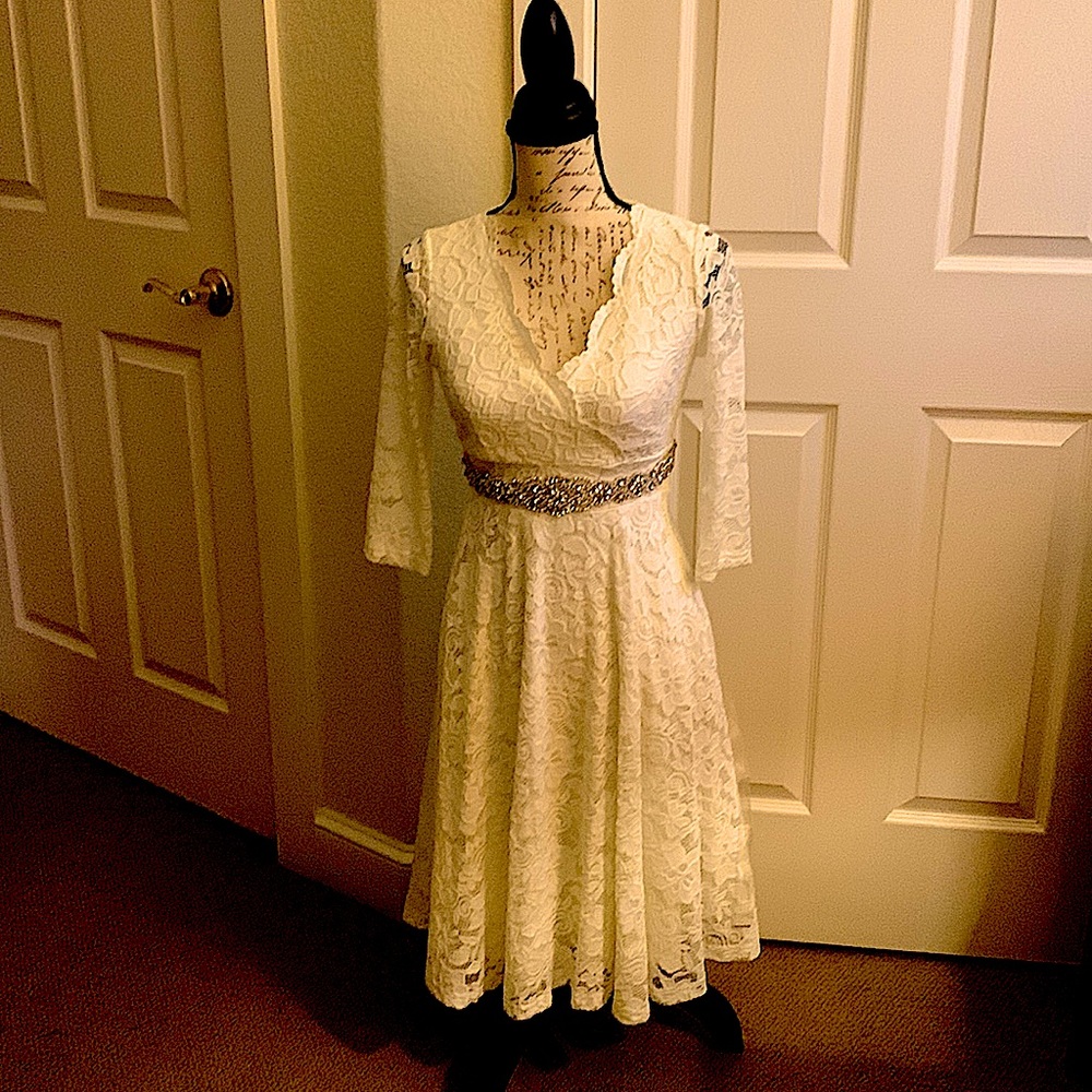 Ivory lace v-neck dress.